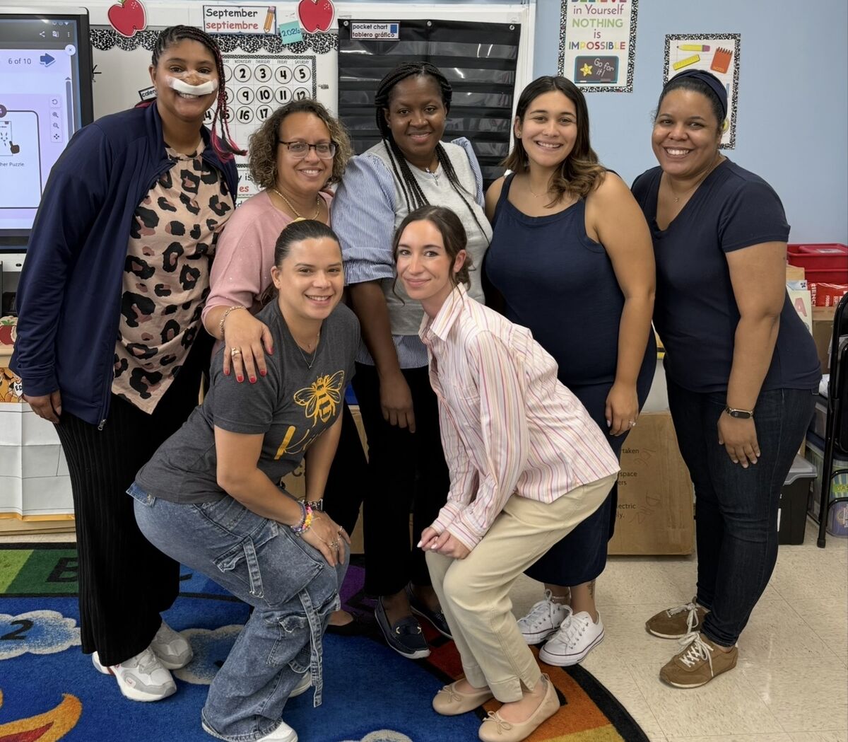 The Kindergarten teaching team posing together in their classroom.